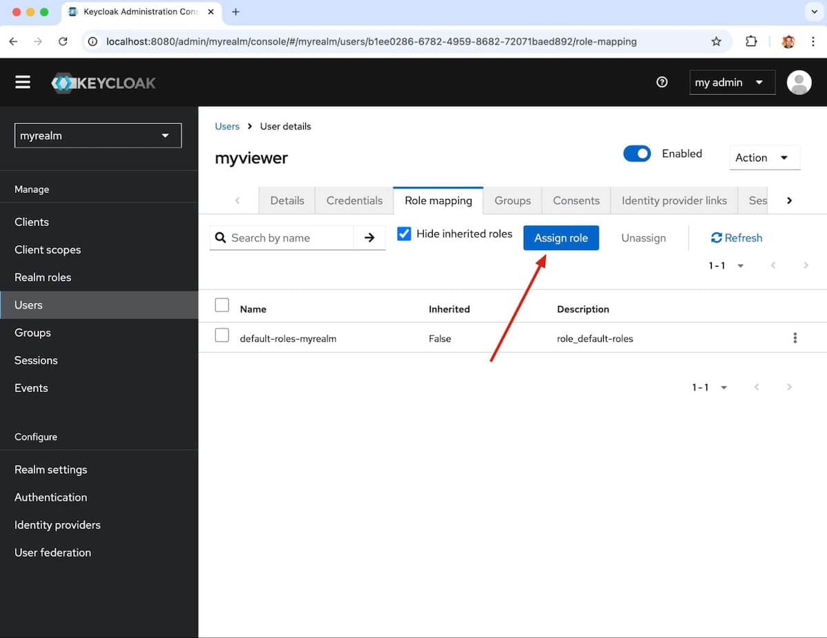 A screenshot of a Keycloak window with an arrow pointing to the Assign role button